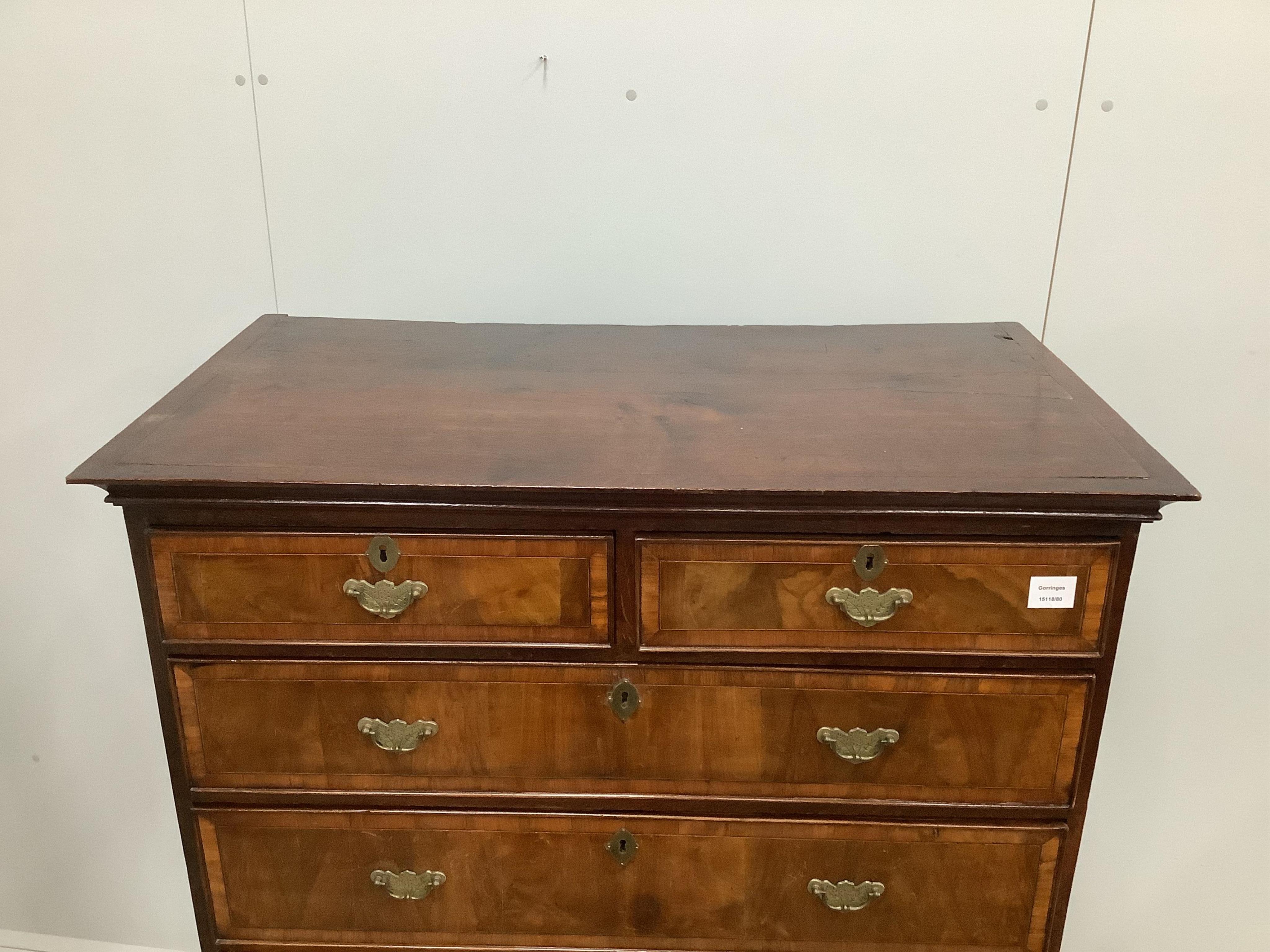 An 18th century banded walnut chest on stand, width 97cm, depth 53cm, height 152cm. Condition - fair
